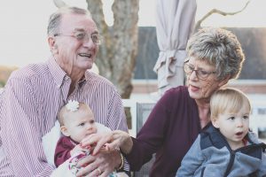 The benefits of being around your grandchildren include helping you feel younger, decrease stress, increase your lifespan, and make you happier overall.