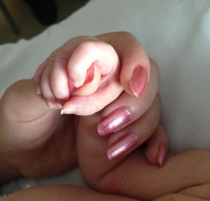 holding hands with baby