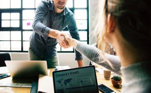 shaking hands in business meeting