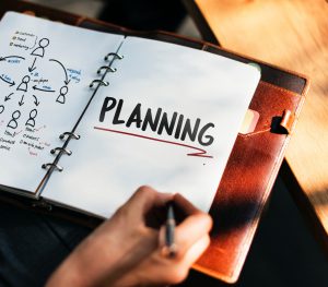 business notebook with planning underlined