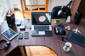 business desk full of technology