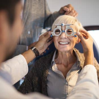 Senior woman going through eye exam
