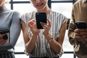 woman looking at social media on her phone