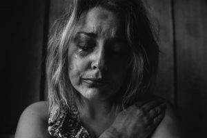 woman crying over a funeral