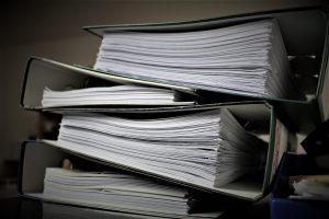 stack of insurance folders for a business