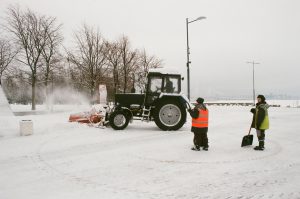 commercial insurance rates for workers operating tractor to clear snow
