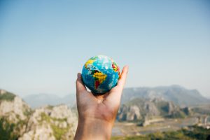 hand holding a mini globe