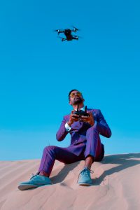 pilot with drone insurance flying a drone