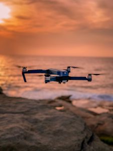 drone insurance for drone flying in the sunset