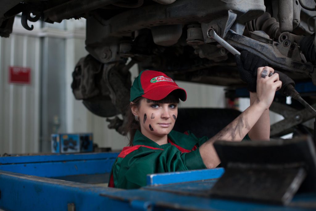 automotive worker fixing a car as employee