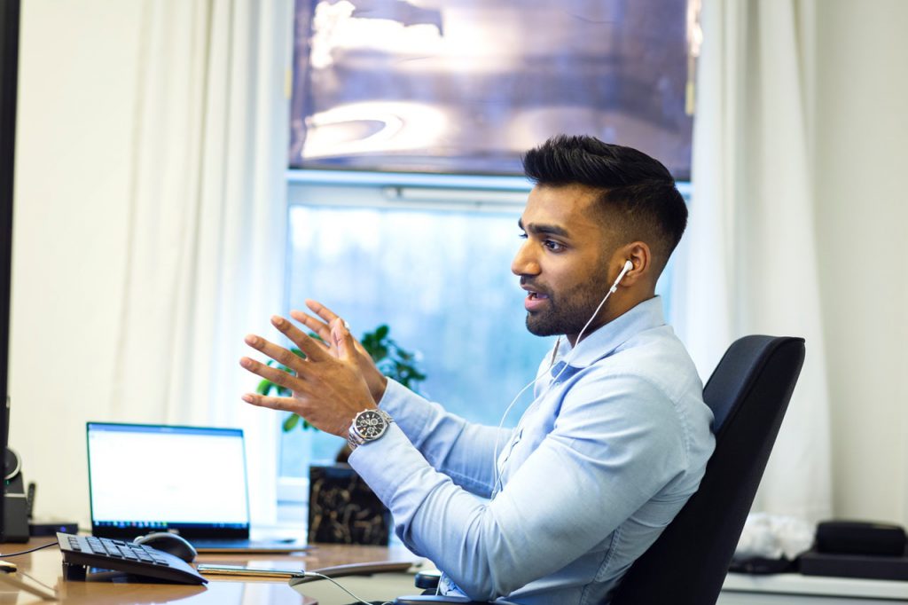 man arguing on a call with headset