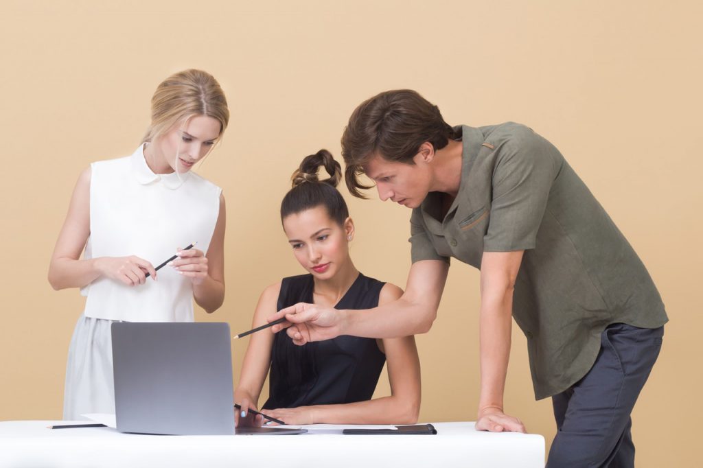 people in a meeting over commercial insurance and medicare