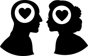 Silhouette of a omwn and woman facing each other with a white circle in their heads and a black heart in the middle of the circle.
