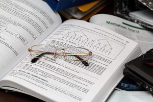 document with glasses for employer health