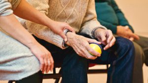 person using an exercise ball for their health paid by Medicare