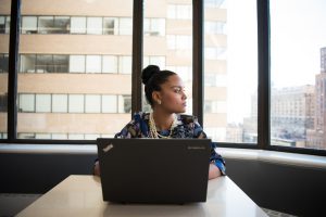 woman looking for insurance on her laptop on EZ.Insure
