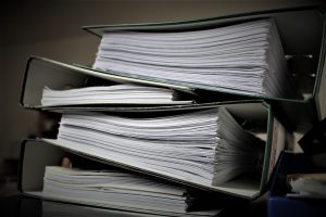 group of papers and folders for employer health
