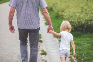 elder walking with child to their PPO or HMO