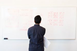 man looking at parts of worker's compensation