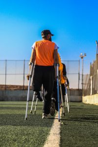 person with crutches covered by worker's compensation