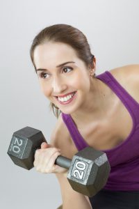 woman lifting weight for her PPO or HMO