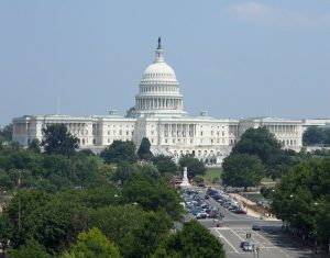 a picture of the outside of congress with trees around it.