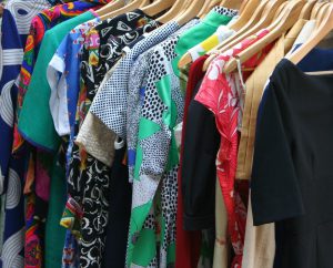 closet full of colorful dresses.