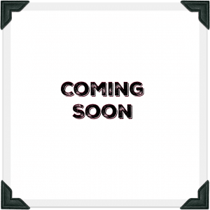 White sign with black letters that say "coming soon" in the middle
