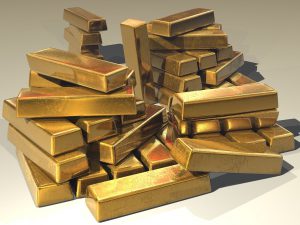 a pile of blocks of gold stacked on top of each other.