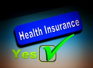 health insurance words in a blue box with a green check in a box next to a yes