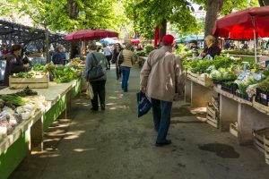 farmer's market with people walking around.