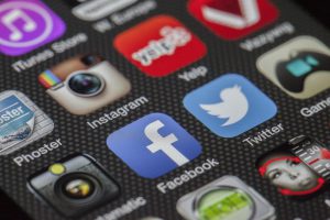 social media platform apps on a cellphone screen.