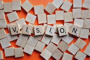 scrabble pieces that spell out "vision."