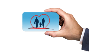 man's hand holding a blue card with a family inside a heart on it. 