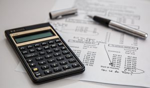 calculator with a pen and paper