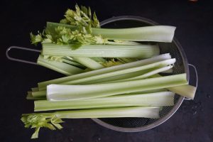celery stalks in a collander.
