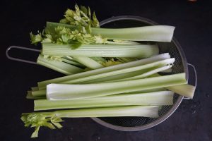 celery stalks in a collander. 