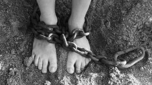 feet of a child with chains on it
