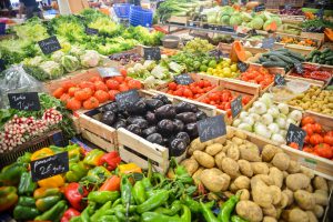 Market full of fresh produce of all different kinds.