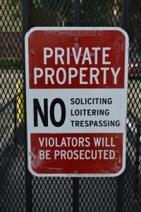 red and white private propery sign