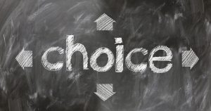 the word choice written in chalk on blackboard  with arrows all around it