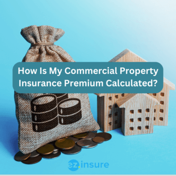 How Is My Commercial Property Insurance Premium Calculated? text overlaying image of a bag of money and wooden buildings