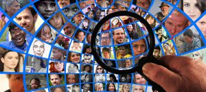magnifying glass over a many clustered pictures of people