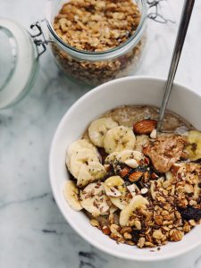 bowl filled with bananas, oats and nut butter.