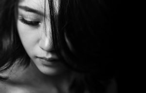 black and white picture of woman looking down