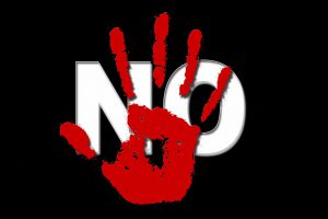 red hand over the word no in white