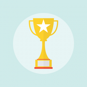 yellow trophy with a star in the middle of the cup part.