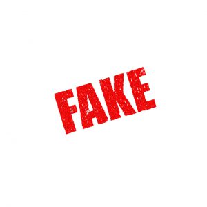 the word "Fake" in red.