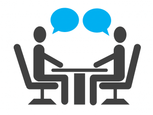 illustration of two people sitting at a table with two blue speech bubbles