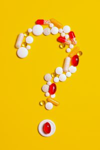 question mark made out of pills